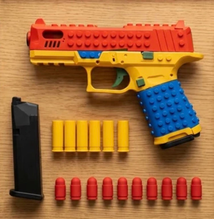 SnapBuild soft-tip bullets with red tips, gold shell casings and a black magazine, shown next to the SnapBuild blaster