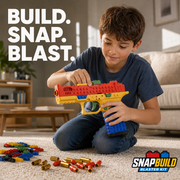 Boy sitting on a living room rug snapping bricks onto his SnapBuild blaster, with red-tipped soft bullets, gold shell casings and extra bricks nearby