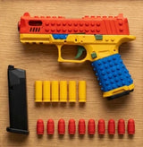 SnapBuild soft-tip bullets with red tips, gold shell casings and a black magazine, shown next to the SnapBuild blaster